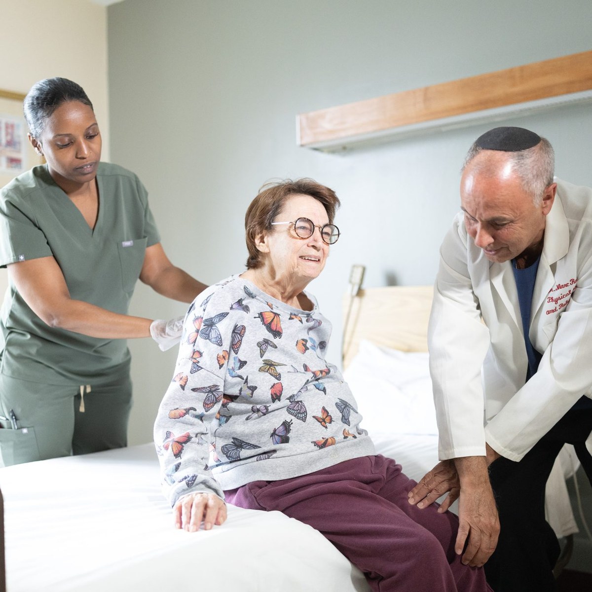 Dr. Marc Rosenblatt at the bedside with a nurse and patient